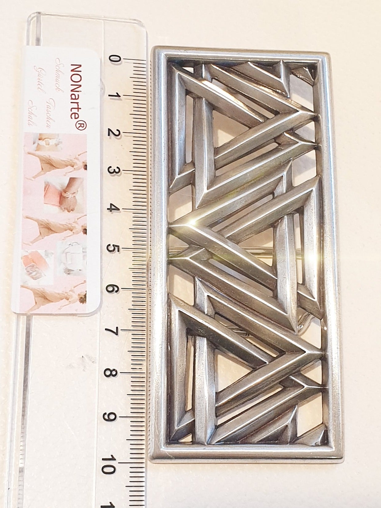 Große Gürtelschnalle mit geometrischem Muster eckig in Silber